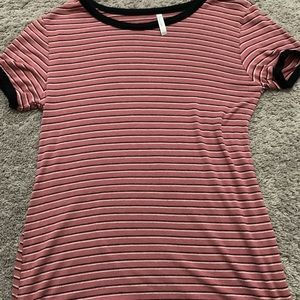 A medium pink, black, white striped short sleeve